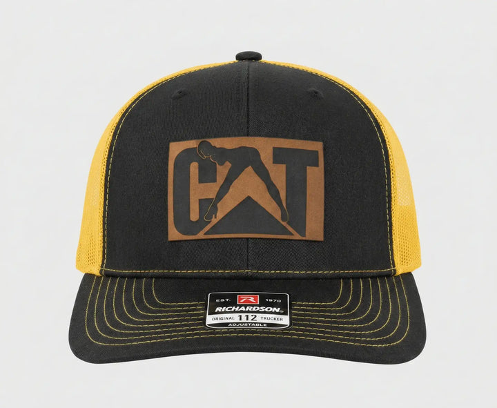 CAT Stripper Hat | Richardson 112 Gold/Black Trucker Cap with Laser Engraved Leather Patch