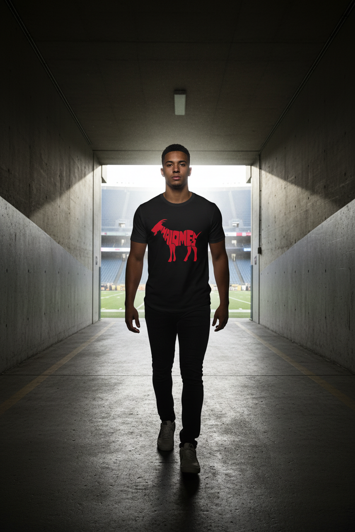 Mahomes GOAT tee black – man walking through stadium tunnel