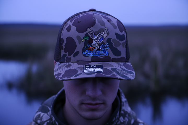 Tight portrait in duck hunting hat at twilight